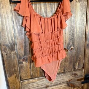 Free people sheer ruffle body suit in burnt orange